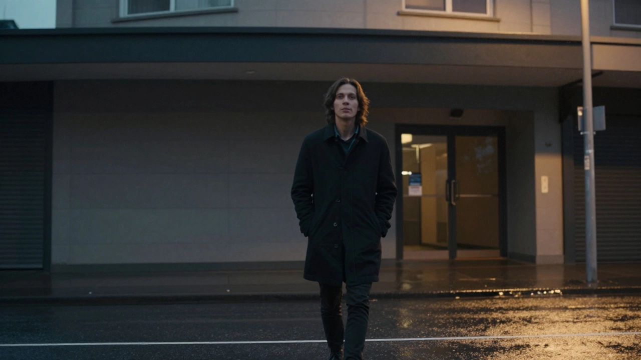 A person walks away from a discreet building at twilight, looking calm and at peace.