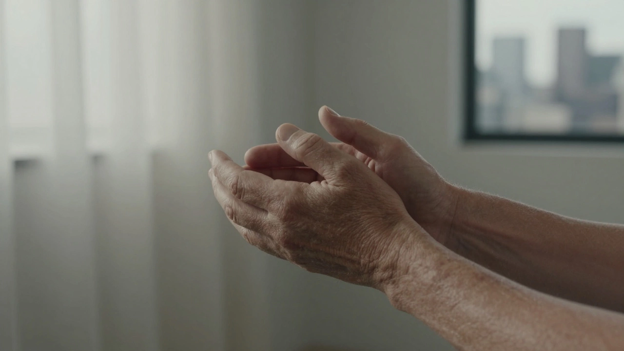 Two hands resting together in quiet comfort, morning light filtering through sheer curtains.